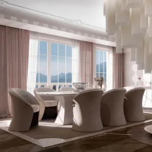 Dining room with rounded barrel-back chairs around a table and floor-to-ceiling mountain-view windows